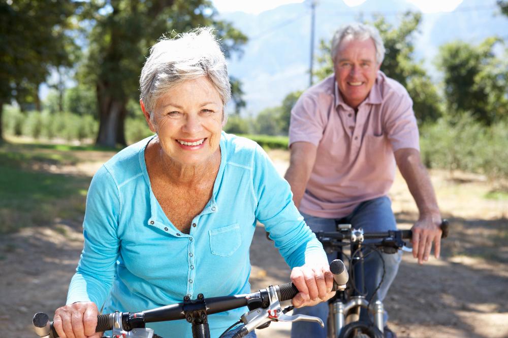 older couple riding bikes | airway dentist near me