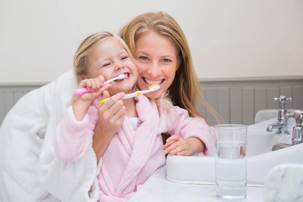 mother and child brushing teeth in oakbrook terrace il