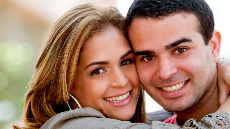 young couple hugging | dental bonding oakbrook terrace il