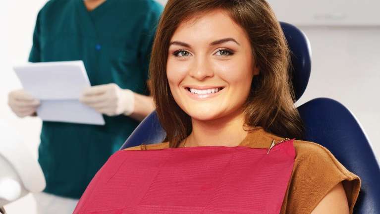 Woman getting a dental cleaning in oakbrook