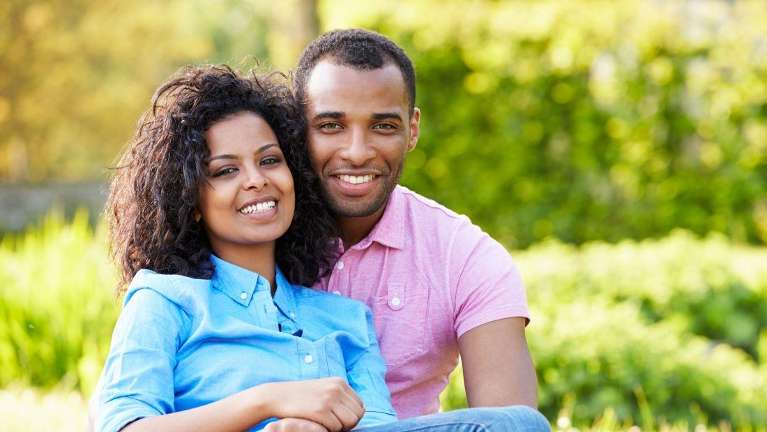 young couple hugging outside | dentist in oakbrook terrace 