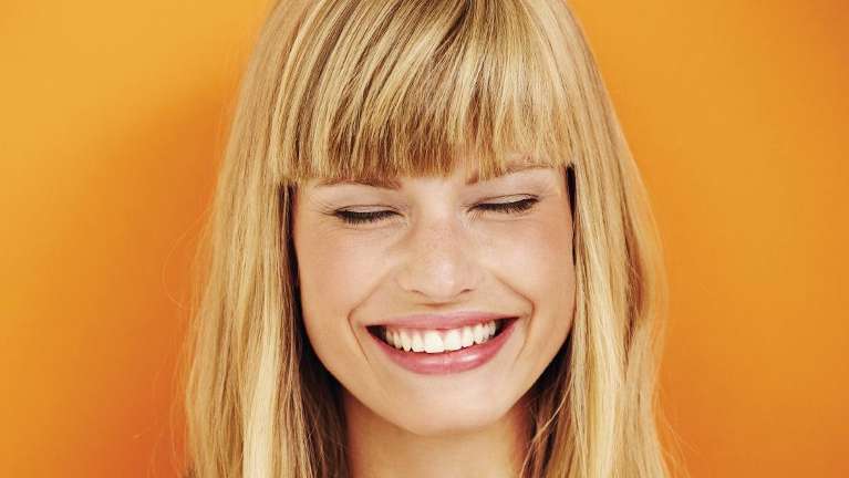 blonde woman smiling | bioclear method oakbrook terrace il