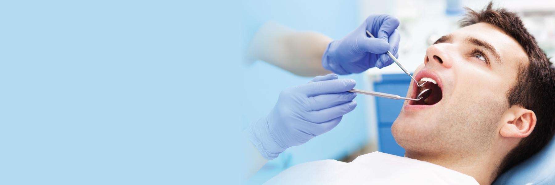 man receiving dental exam | dentist in oakbrook terrace