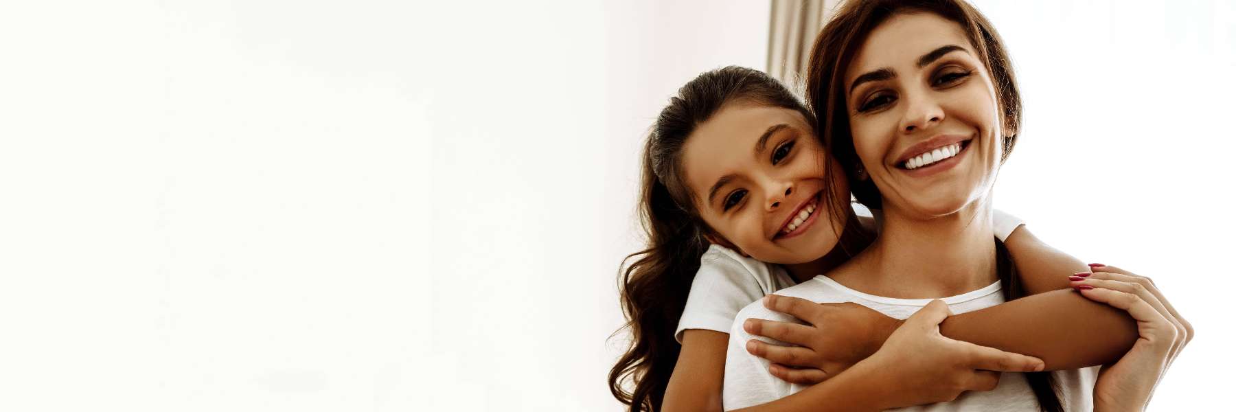 mother and daughter hugging | dentist oakbrook terrace il